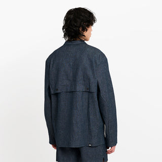 back view of ciele athletics CCJacket unisex running jacket from the Lifestyle Edition collection, in denim indigo color, on a model