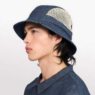 side view of ciele athletics GOBucket unisex running bucket hat from the Lifestyle Edition collection, in denim indigo color, on a model