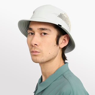 side view of ciele athletics GOBucket unisex running bucket hat from the Lifestyle Edition collection, in light grey color, on a model