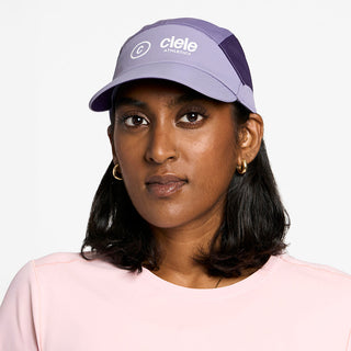 front view of the ciele athletics FTSCap unisex running hat with a curved brim in light grape color, on a model