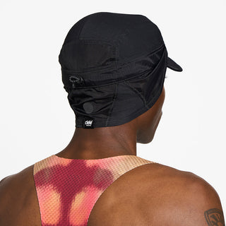 back view of ciele athletics GOCap solar unisex running hat from the Elite collection in shadowcast color, on a model with the side shield unfolded