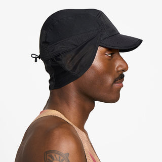 side view of ciele athletics GOCap solar unisex running hat from the Elite collection in shadowcast color, on a model with the side shield unfolded