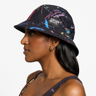 side view of ciele athletics GOBucket Comp Athletics unisex running bucket hat in the summer night limited edition, on a model