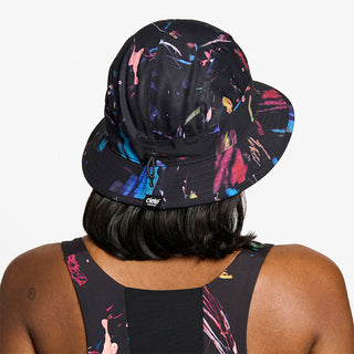 back view of ciele athletics GOBucket Comp Athletics unisex running bucket hat in the summer night limited edition, on a model