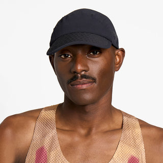 front view of ciele athletics FSTCap unisex running hat from the Elite collection in shadowsphinx color, on a model