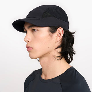 side view of ciele athletics new FSTCap ethereal unisex running hat from the Elite collection in shadowcast color, on a model