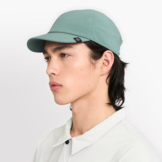 side view of ciele athletics CRWCap short brim unisex running hat with shorter brim from the Lifestyle Edition collection, in silver pine color, on a model