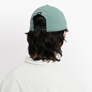 back view of ciele athletics CRWCap short brim unisex running hat with shorter brim from the Lifestyle Edition collection, in silver pine color, on a model