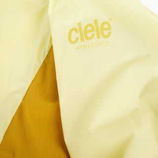 view of the ciele athletics VNTJacket lightweight running jacket for women in glade color when folded in one of it's pocket