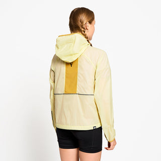 back view of ciele athletics VNTJacket lightweight running jacket for women in glade color on a model