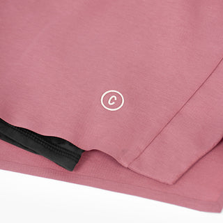 close view of the C logo and fabrics on the ciele athletics DLYShort 4 inch with a long brief in deco rose color