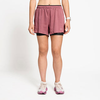 front view of ciele athletics DLYShort 4 inch with a long brief in deco rose color on a model