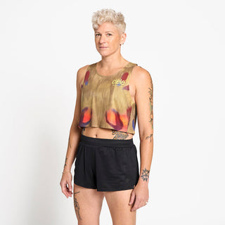side view of the ciele athletics lightweight, race ready and performance driven Singlet for womens named RDCRPSinglet in sphinx color, on a model