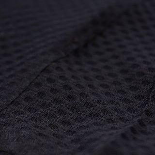 close up of the fabric of the ciele athletics lightweight, race ready and performance driven Singlet for womens named RDCRPSinglet in shadowsphinx color