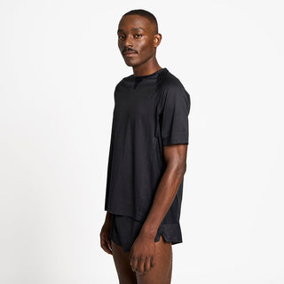 side view of the ciele athletics lightweight, race ready and performance driven T-Shirt named RCDTShirt in shadowsphinx color, on a model