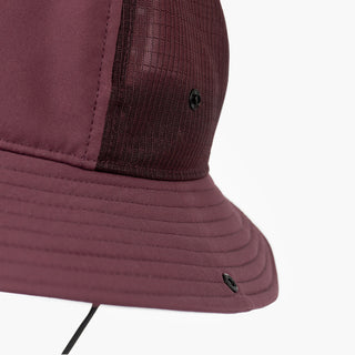 closeup view of the ciele athletics TRLBucket unisex running bucket hat side button closure in dark wine red color