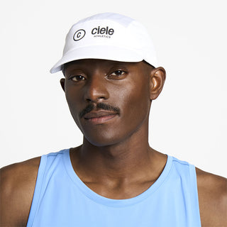 front view of ciele athletics FSTCap SC Classic C Side unisex running hat in whitaker color on a model