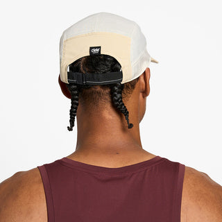 back view of the ciele athletics GOCap unisex running hat in safari color, on a model
