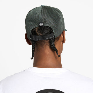 back view of the ciele athletics TRLCap unisex running hat with a curved brim in silver pine color, on a model